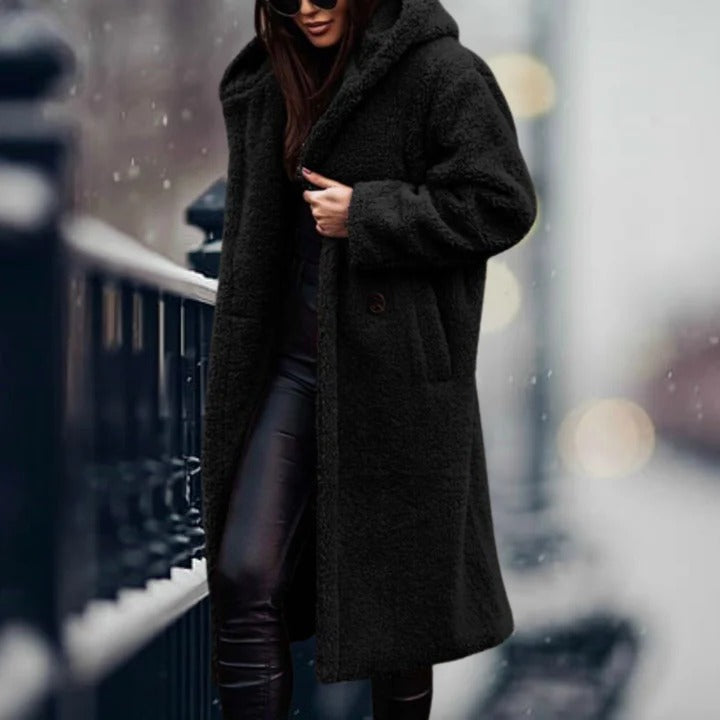 Women's fur hooded jacket, perfect for staying warm and stylish during cold weather.