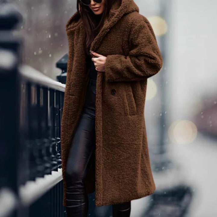 Women's fur hooded jacket, perfect for staying warm and stylish during cold weather.