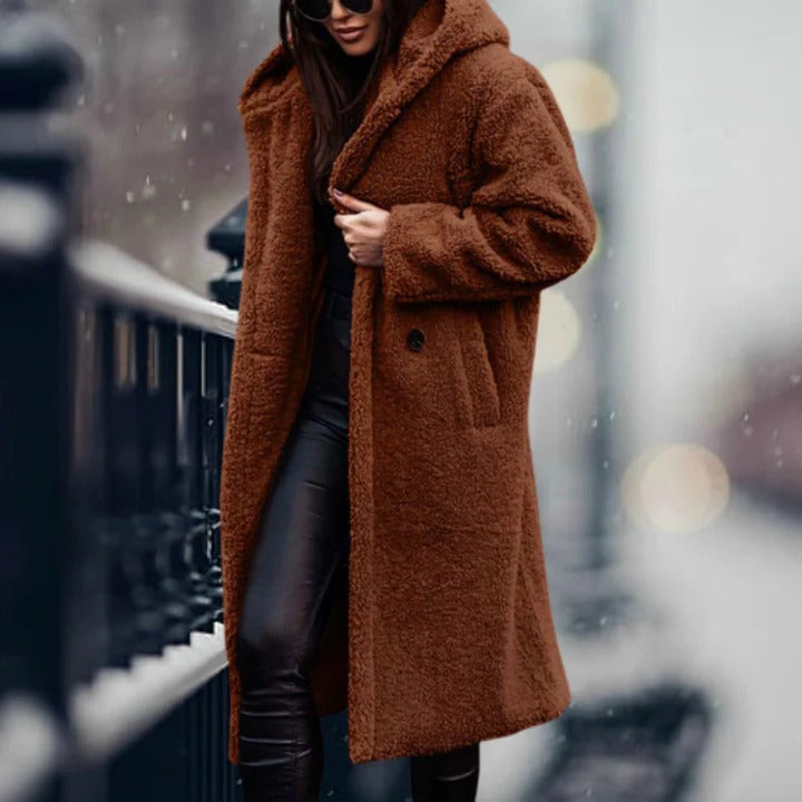 Women's fur hooded jacket, perfect for staying warm and stylish during cold weather.