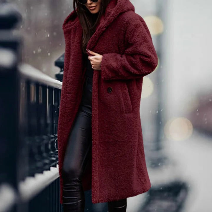 Women's fur hooded jacket, perfect for staying warm and stylish during cold weather.