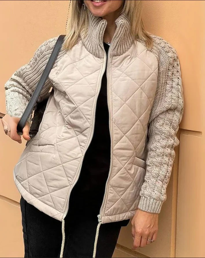 Luxurious padded jacket, providing warmth and style for winter with a sleek, flattering fit.