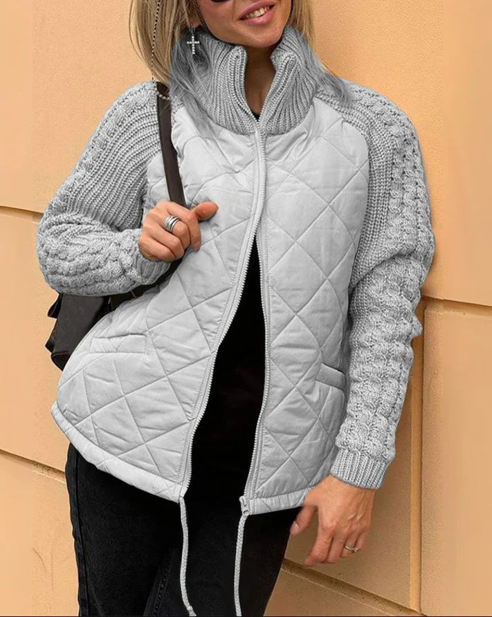 Luxurious padded jacket, providing warmth and style for winter with a sleek, flattering fit.